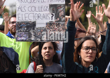 October 2, 2017 - Barcelona, Spain: Portrait of Carla Comella (C), an 18 yo Catalan student  as she takes part in a rally in front of Barcelona university to protest against police brutality and demand independence a day after Catalonia held a historic referendum.  She holds a banner made of press clippings and photos showing Spanish police attacking voters at Catalan ballot stations.  Manifestation d'etudiants catalans en faveur de l'independance de la Catalogne. *** FRANCE OUT / NO SALES TO FRENCH MEDIA *** Stock Photo