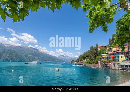 Panoramic view of Varenna with  boats on Lake Como, Lombardy, Italy Stock Photo