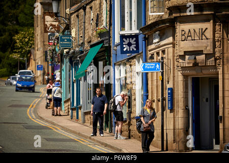 Sandstone shops and Royal Bank of Scotland on  Bridge Street, Ramsbottom village, Lancashire. Stock Photo