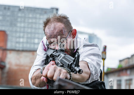 Powerful man Holding Gun. War Action Movie Style Stock Photo