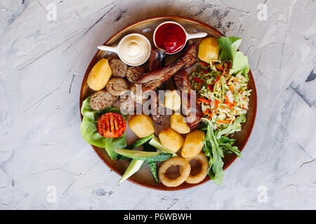 Top view of clay plate full of appetizers for beer. Stock Photo