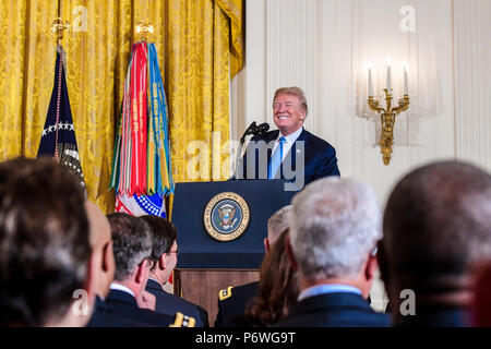 President Donald J. Trump gives his remarks during the Medal of Honor ceremony for then- U.S. Army 1st Lt. Garlin M. Conner at the White House in Washington, D.C., June 26, 2018. Conner was posthumously awarded the Medal of Honor for actions while serving as an intelligence officer with Headquarters and Headquarters Company, 3rd Battalion, 7th Infantry Regiment, 3rd Infantry Division, during World War II on Jan. 24, 1945.  (U.S. Army photo by Spc. Anna Pol) Stock Photo