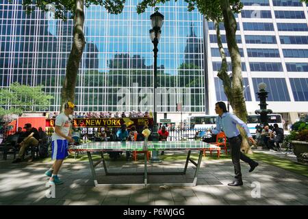 New York, USA. 26th June, 2018. People play ping pong at Bryant Park in New York, the United States on June 26, 2018. TO GO WITH Feature: Ping pong becomes popular pastime sport in New York City Credit: Lin Bilin/Xinhua/Alamy Live News Stock Photo