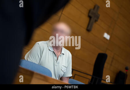 Germany, Traunstein. 03rd July, 2018. The 63 year old defendant who is charged for 2 murders is in the court room of the City court. The man is said to have killed two men in a pub in September 2017 and seriously injured the landlady and her acquaintances. (Attention: the defendant was defaced as requested by his lawyers.) Credit: Sven Hoppe/dpa - ATTENTION: individual(s) has/have been pixelated for legal reasons/dpa/Alamy Live News Stock Photo