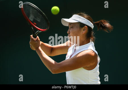 (180703) -- LONDON, July 3, 2018 (XINHUA) -- Peng Shuai of China hits a return during the women's singles first round match against Samantha Stosur of Australia at the Championship Wimbledon 2018 in London, Britain, on July 3, 2018. Peng Shuai lost 0-2. (Xinhua/Tang Shi) Stock Photo