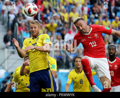 Saint Petersburg, Russia. 3rd July, 2018. Josip Drmic (R) of Switzerland vies with Ola Toivonen of Sweden during the 2018 FIFA World Cup round of 16 match between Switzerland and Sweden in Saint Petersburg, Russia, July 3, 2018. Credit: Yang Lei/Xinhua/Alamy Live News Stock Photo