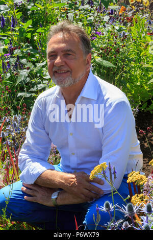 London, UK. 2nd-8th July 2018. RHS Hampton Court Flower Show. Chef and TV celebrity Raymond Blanc in the RHS garden Grow Your Own with The Raymond Blanc Gardening School.     - Designers: Allister Dempster & Rossana Porta  - Sponsor: n/a Stock Photo