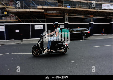Deliveroo moped delivery in Brighton, English Seaside Town, Brighton & Hove, East Sussex, England, UK Stock Photo
