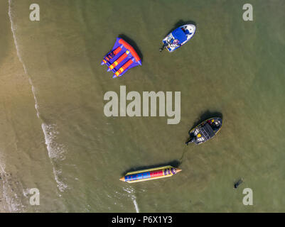 Bird's eye view of recreational boats (banana boat, flying fish, and jet ski) parked on a beach of Laiya, San Juan, Batangas Stock Photo