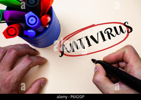 Conceptual hand writing showing Antivirus. Business photo text Safekeeping Barrier Firewall Security Defense Protection Surety Man holding black marke Stock Photo