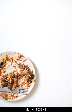 Dish of noddles finished dirty and empty ready to throw away Stock Photo