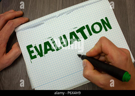 Conceptual hand writing showing Evaluation. Business photo text Judgment Feedback Evaluate the quality performance of something Man hold holding black Stock Photo