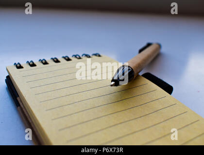 Pen over a Small notebook. Stock Photo