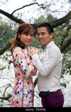 Happy couple at Hoan Kiem lake , Hanoi , Vietnam Stock Photo