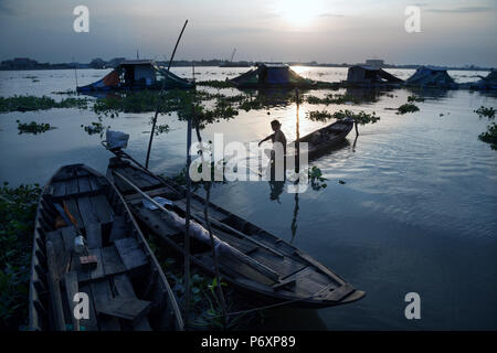 Amazing sunset landscape on Mekong river with boat from An Binh island , Vietnam Stock Photo