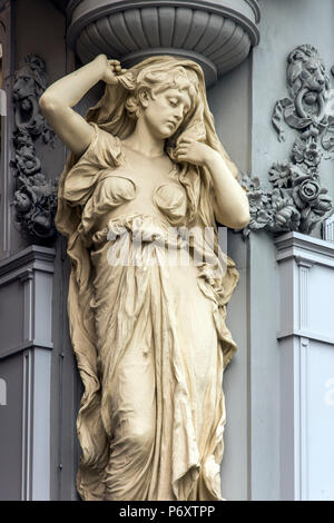 Caryatid sculpted female figure statue on the facade of a building in Tuchlauben street, Vienna, Austria Stock Photo