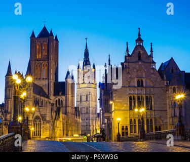 Belgium, Flanders, Ghent (Gent). Sint-Niklaaskerk (Saint Nicholas' Church) and Het Belfort van Gent, 14th century belfry, at night from St. Michael's Bridge. Stock Photo