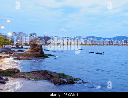 Brazil, State of Rio de Janeiro, Niteroi, Twilight view towards Icarai Beach with Skyline of Niteroi. Stock Photo