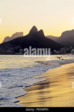 Brazil, City of Rio de Janeiro, Ipanema Beach and Morro Dois Irmaos during sunset. Stock Photo
