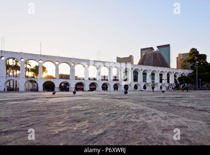 Brazil, City of Rio de Janeiro,  Lapa, View of The Carioca Aqueduct known as Arcos da Lapa during sunset. Stock Photo