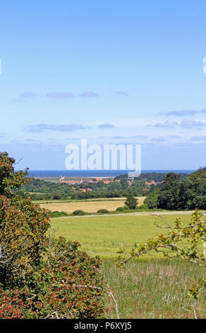 A view towards Cley Next the Sea in North Norfolk from Wiveton, Norfolk, England, United Kingdom, Europe. Stock Photo