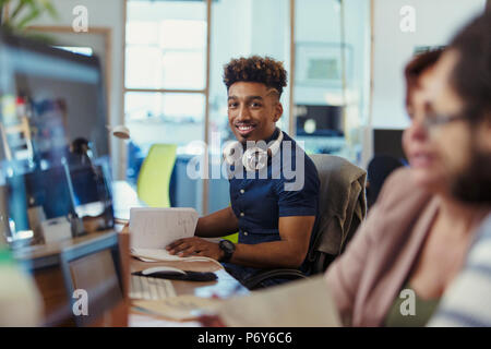 Portrait smiling, confident creative businessman working in office Stock Photo