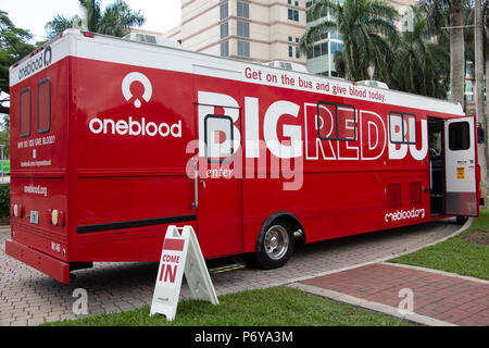 OneBlood Big Red Bus mobile blood donation center at Nova Southeastern University main campus - Fort Lauderdale, Florida, USA Stock Photo