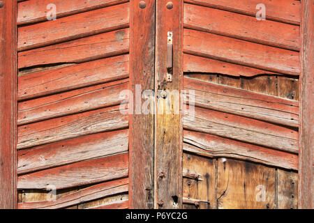 Ancient wooden door / old red  wooden door /  white background Stock Photo