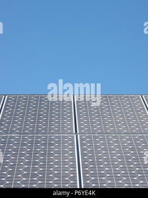Solar Panels for producing electricity against a clear blue sky Stock Photo