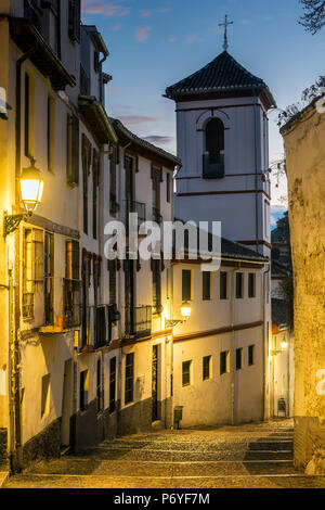 Picturesque view at dusk of a street in the Albayzin district, Granada, Andalusia, Spain Stock Photo