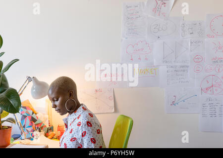 Creative businesswoman working at desk in office Stock Photo
