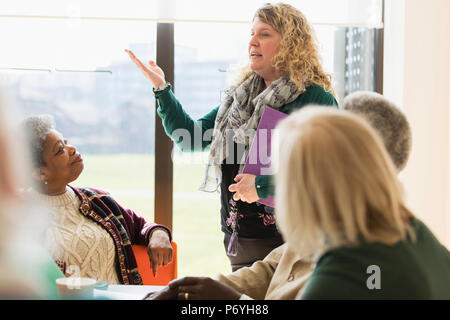 Businesswoman leading conference room meeting Stock Photo