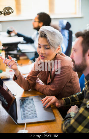 Creative business people meeting, working at laptop Stock Photo