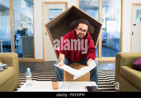 Portrait smiling, confident creative businessman working in office Stock Photo