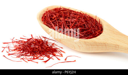 saffron thread in the wooden spoon, isolated on white background Stock Photo