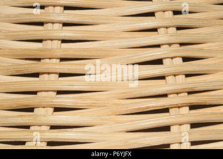 Light bright beige wicker traditional old basket texture with cross braided fiber. Seamless background close up. Brown textured wooden pattern Stock Photo