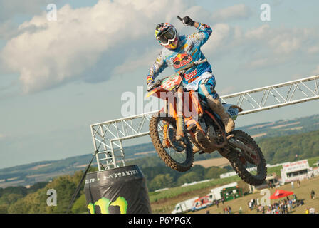 Tony Cairoli, Italian nine times motocross world champion in mid air on his motorbike after winning an event Stock Photo