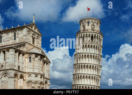 Square of Miracles landmarks: Pisa Cathedral and the famous Leaning Tower, among beautiful clouds. Unesco Wolrld Heritage Stock Photo