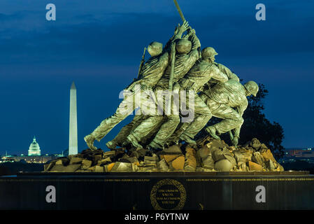 USA, District of Columbia, Washington, US Marine Corps War Memorial also known as the Iwo Jima Memorial with Washington Monument Stock Photo