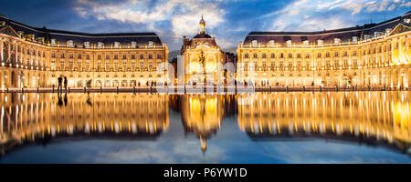 Place la Bourse in Bordeaux, the water mirror by night, France Stock Photo