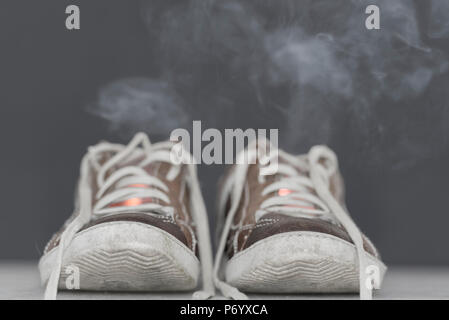 Shoes on Fire with Smoke. Stock Photo