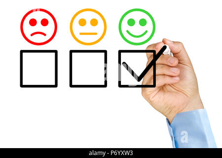 Hand putting check on customer service evaluation form Stock Photo