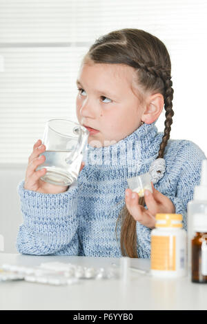 young sick girl taking  medicines Stock Photo