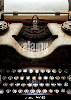 Close up of old typewriter covered with dust Stock Photo