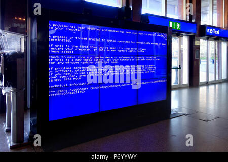 Rome, Italy - Jan 2015: The Blue Screen of Death in the video wall at termini railway station in Rome that is an error screen displayed after a fatal  Stock Photo
