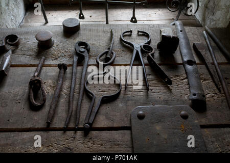 Tools used in the Forge at the Rogatec Open Air Museum, very close to the Croatian border, on 24th June 2018, in Rogatec, Slovenia. The museum of relocated and restored 19th and early 20th century farming buildings and houses represents folk architecture in the area south of the Donacka Gora and Boc mountains. Stock Photo