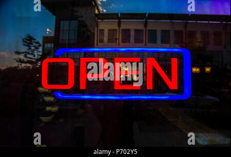 Open sign outside of restaurant Stock Photo