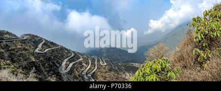 Three Level Zigzag road is probably the most dizzying road in the world. Located in the Sikkim Indian state, in the Himalayan mountains, the road incl Stock Photo