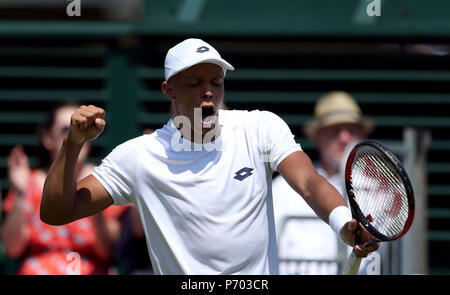Jay Clarke celebrates winning the fourth set against Ernests Gulbis on day two of the Wimbledon Championships at the All England Lawn Tennis and Croquet Club, Wimbledon. Stock Photo
