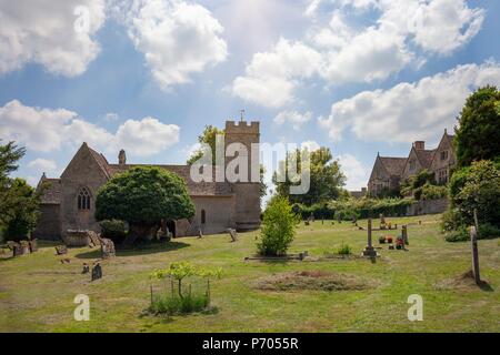 Church and manor at Asthall, Cotswolds, Oxfordshire, England Stock Photo